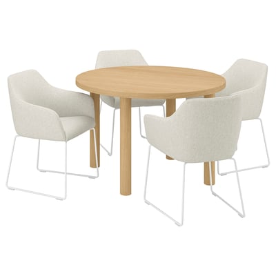 A round oak dining set with four cream-colored armchairs.