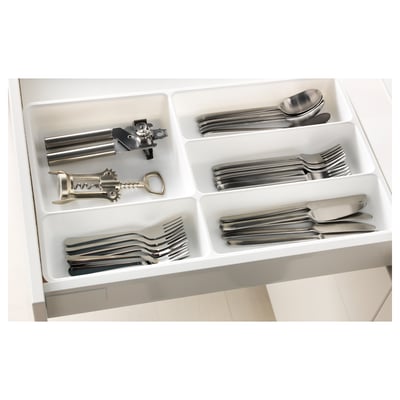 White drawer organiser with cutlery and kitchen tools.