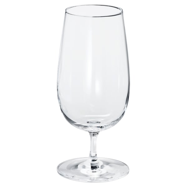 Single empty, clear wine glass with long stem and wide bowl, standing upright.