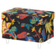 Brightly coloured tropical leaf fabric ottoman with white legs.