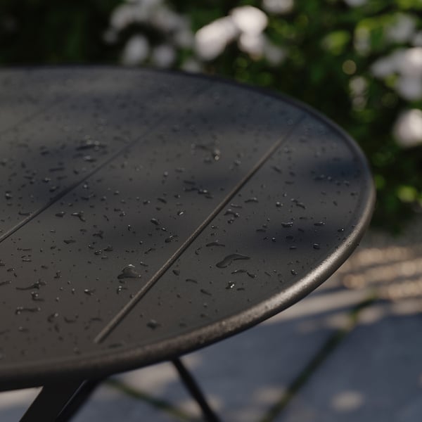 Dark outdoor table, wet surface, modern design, minimalist style.