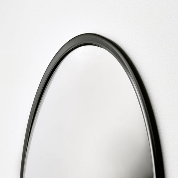 Elegant arched mirror with sleek black frame. Modern design, high-quality finish.