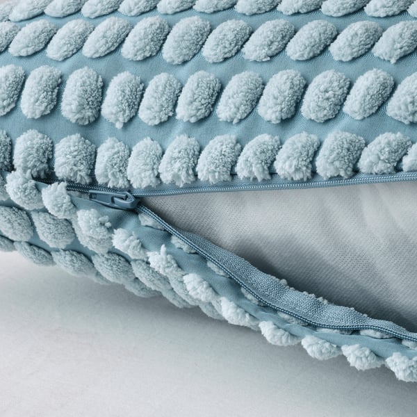 Light blue soft cushion cover with a fluffy, textured pattern. A zip for easy washing. Made from recycled polyester.