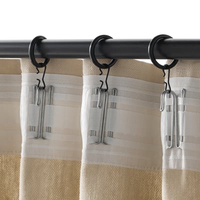 Black curtain rings, clips, and hooks for easy curtain hanging.