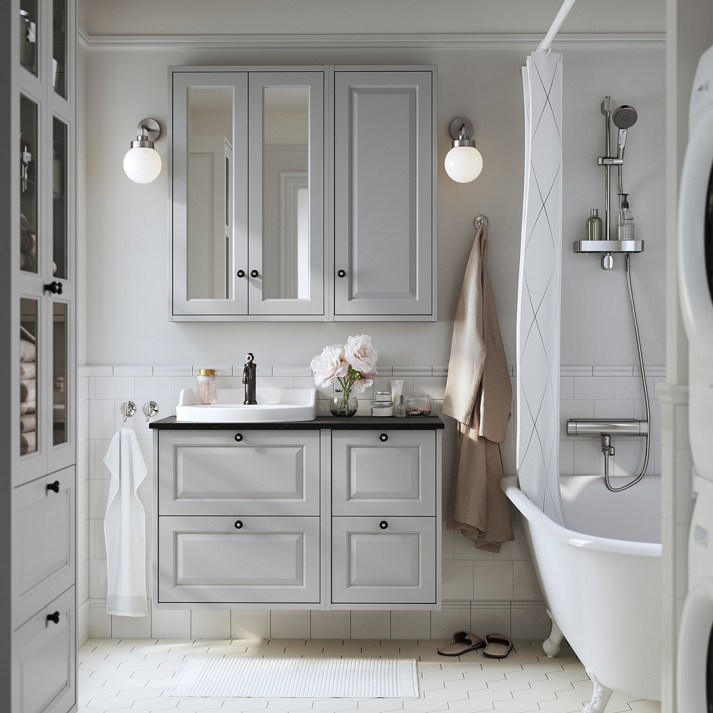 Modern grey bathroom with light wooden cabinets, white tub, sink, and mirror. Wall-mounted cabinets save space, white-tiled floor. Soft lighting.