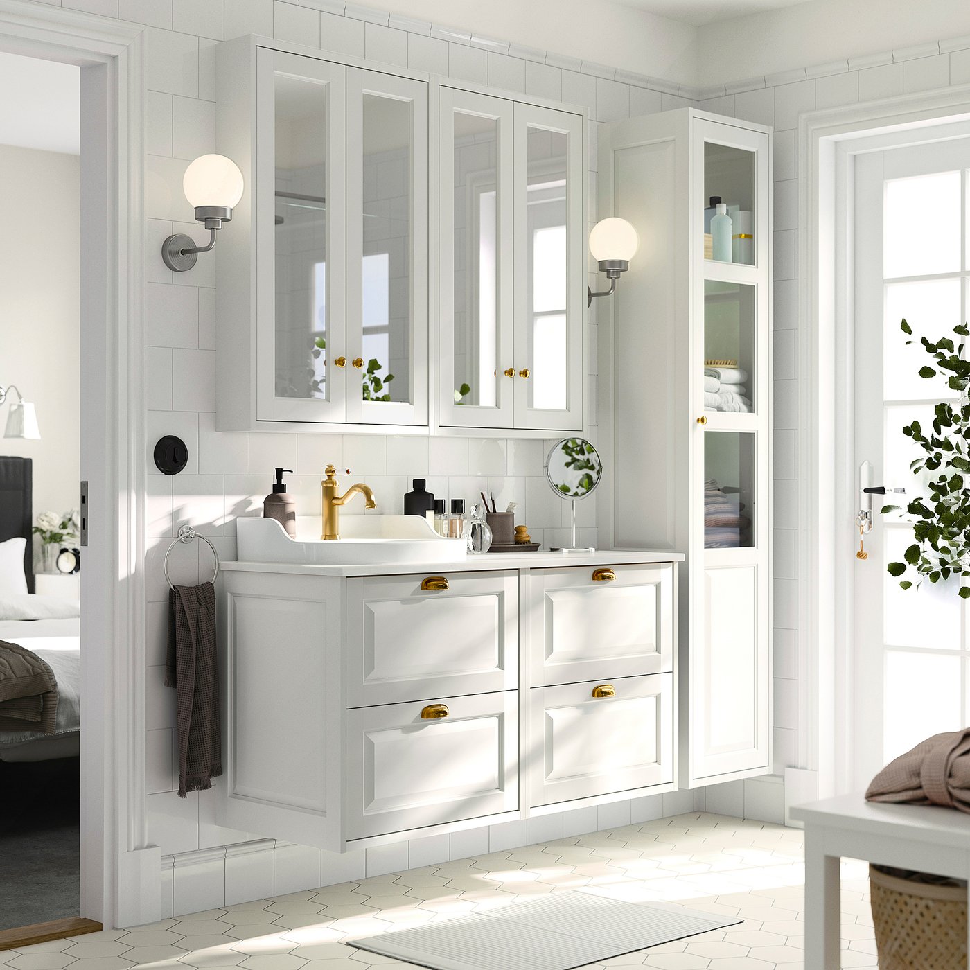 Modern white bathroom with TÄNNFORSEN vanity. Gold fixtures, mirror cabinet, large sink.