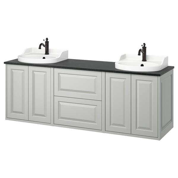 A TÄNNFORSEN white vanity with two sinks and cabinets. Its a modern bathroom piece with light grey, beveled panels, offering ample storage.