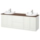 White dual bathroom vanity with wooden top, two sinks, chrome faucets.