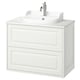 White TÄNNFORSEN bathroom vanity with beveled edges, chrome faucet, cabinet with two drawers.