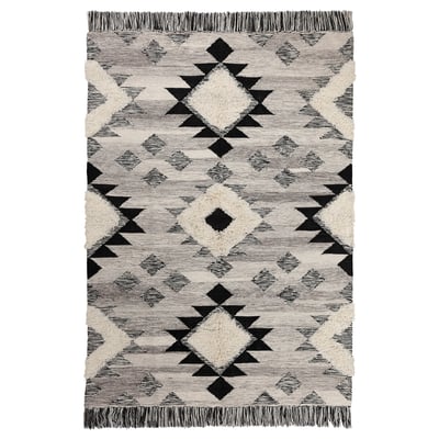 TANNISBY rug, black & white, wool & cotton, geometric designs, long fringes.