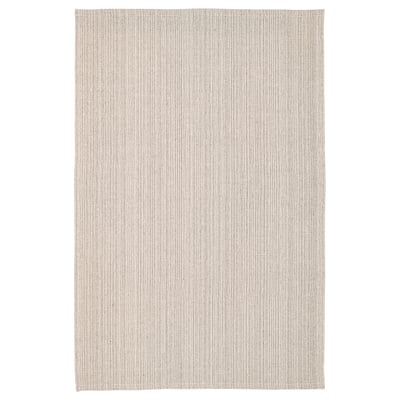 A rectangular, beige TIPHEDE cotton rug. Its simple, flat-woven design is ideal for living rooms or dining areas.