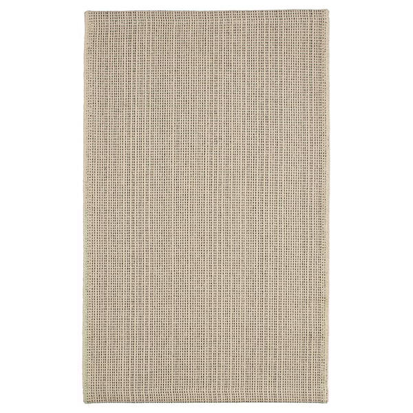 Flatwoven beige cotton rug, grid pattern, rectangular shape.