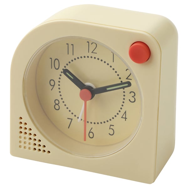A yellow TJINGA alarm clock with a round face, black numbers and hands, and a red snooze button.