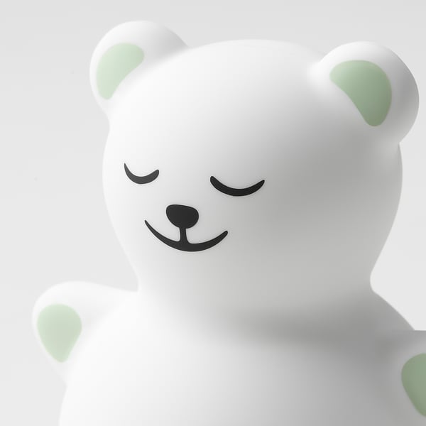 Cute, white teddy bear night light with soft glow, perfect for kids.