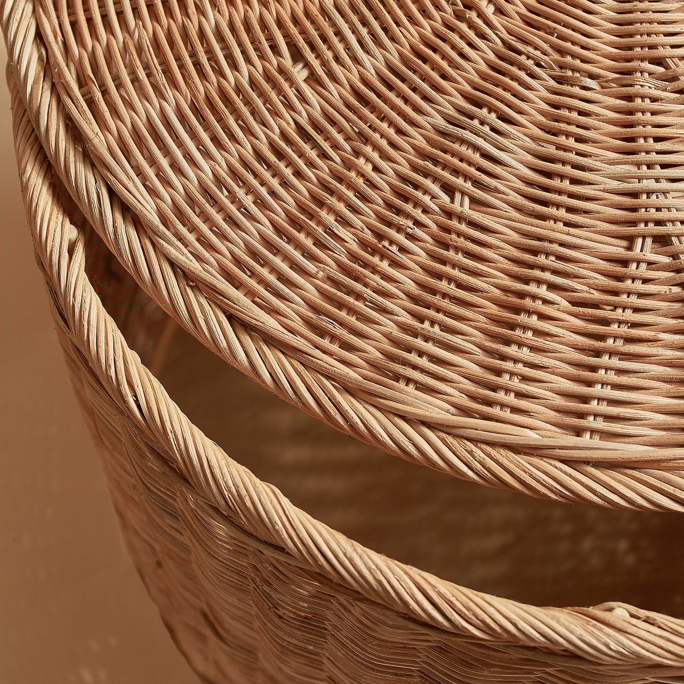 Woven wicker basket detail, tight weave, natural fibres.