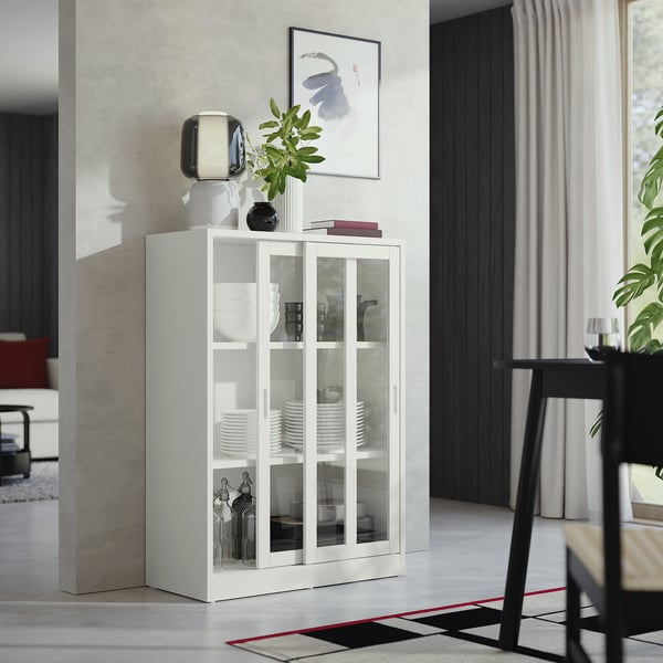 White TONSTAD cabinet display. Glass doors, off-white, classic, modern. Plates, glasses. Sliding doors, clean design.
