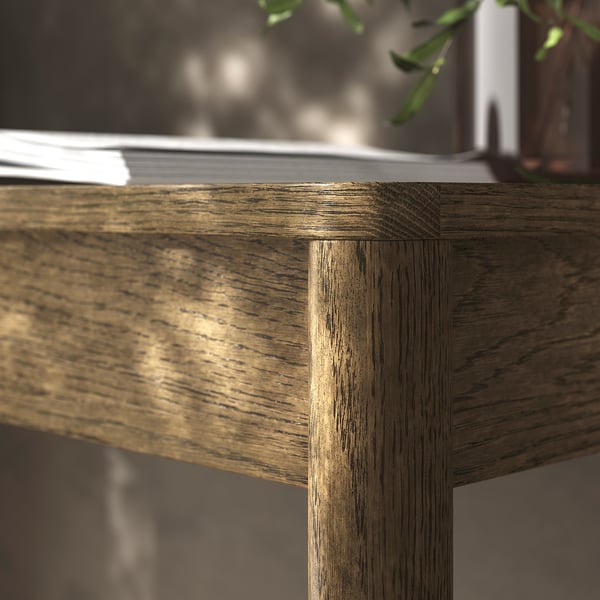 A high-quality oak desk corner, highlighting its smooth, durable veneer finish and robust craftsmanship.