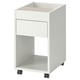 A white TONSTAD drawer unit. It has a minimalist design with four black wheels for easy movement. It one drawer and an open shelf below.