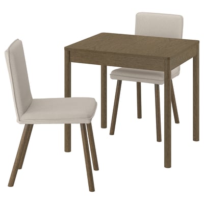 A TONSTAD dining set with a brown wooden table and two beige upholstered chairs. The table has square edges and four angled legs.