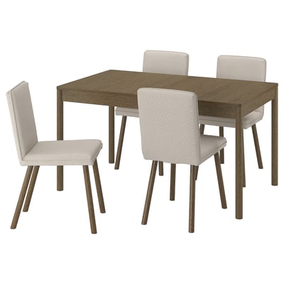 Wooden dining table with four light-colored cushioned chairs.
