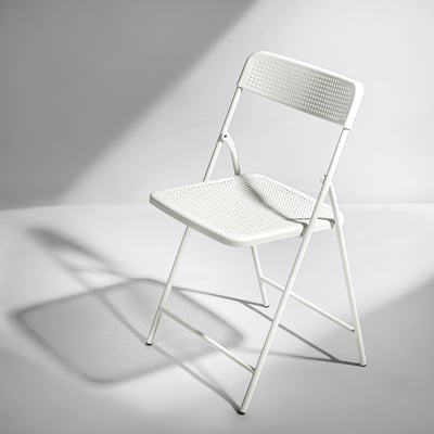 TORPARÖ: foldable white outdoor chair; powder-coated steel and plastic; perforated seat/back for ventilation; compact and sturdy