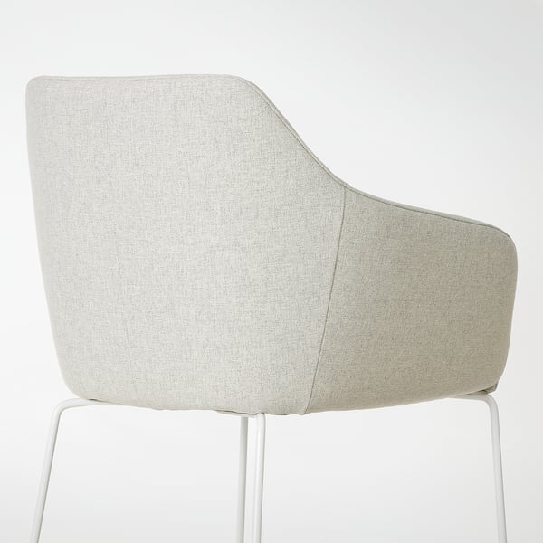 A modern chair with curved back for comfort, featuring thick, beige, recycled fabric upholstery and sturdy white metal legs.
