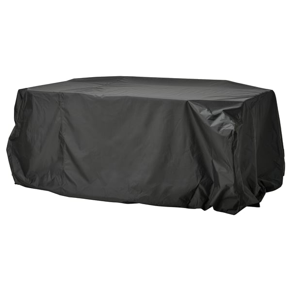 A black TOSTERÖ outdoor furniture cover. Its waterproof, rectangular, and made of polyester with polyurethane coating for protection.