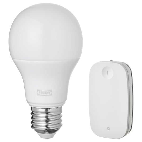 Ikea TRÅDFRI smart light bulb and remote control, white, plastic and metal, rounded and rectangular shapes, wireless design.
