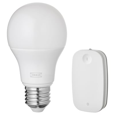 Ikea TRÅDFRI smart light bulb and remote control, white, plastic and metal, rounded and rectangular shapes, wireless design.