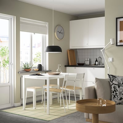 Modern kitchen with TRÄNNÖ stools. Square, stackable, sturdy metal legs, wooden seats. Minimalist design.