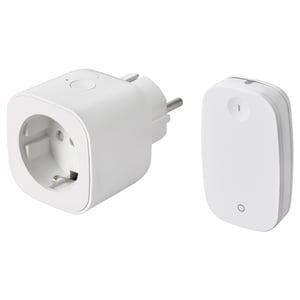 Two white smart plug and remote control devices by IKEA, one with a power outlet, the other with an on/off button.