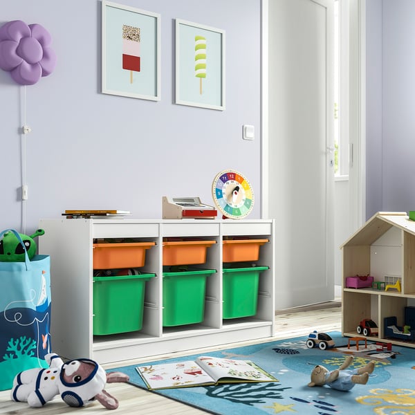 Kids playroom with TROFAST storage, toys, & art.