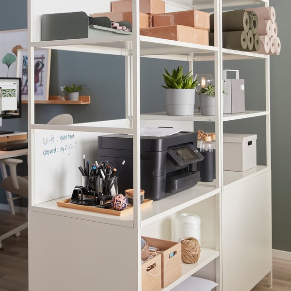 TROTTEN storage unit in office, separating workspace with printer, plant, stationery.