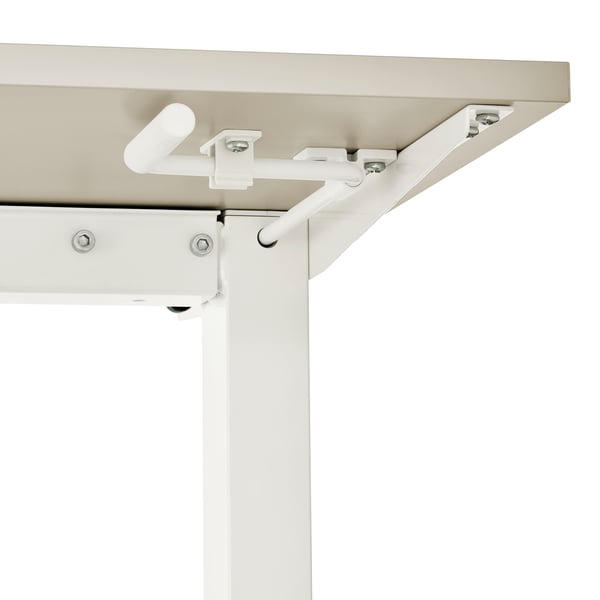 Close-up of a white adjustable desks mechanical handle and frame, showcasing solid construction and smooth height adjustment mechanism.