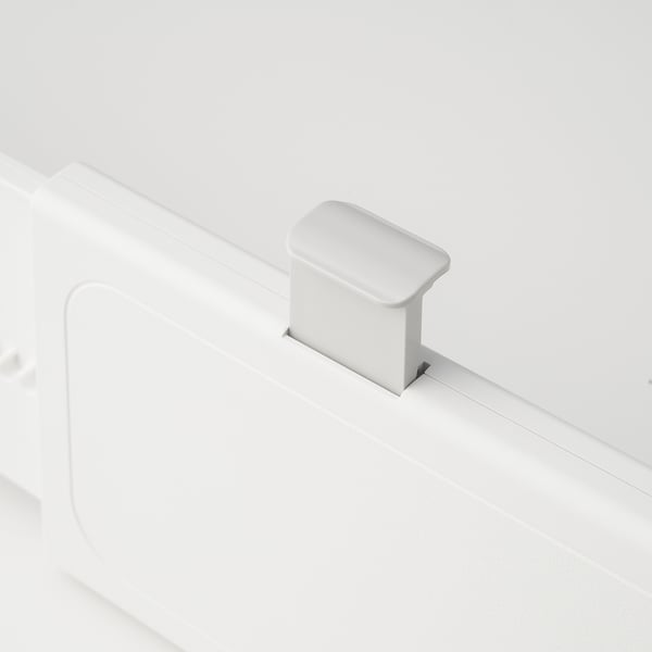 Small white plastic drawer organiser clip, high-quality design, ensures tidy storage.