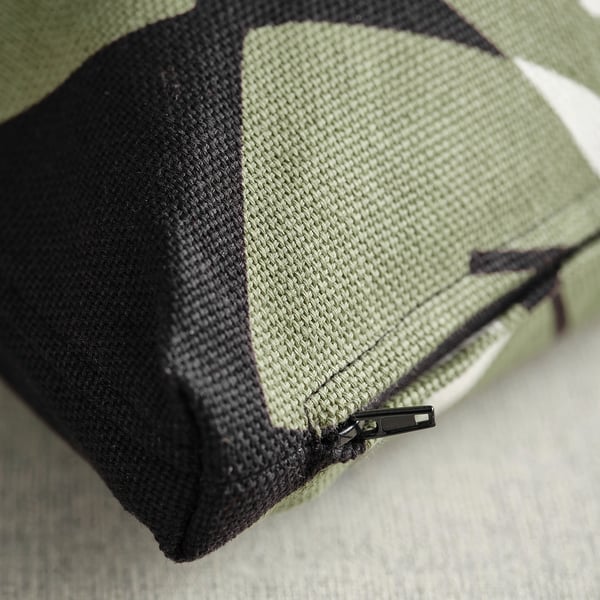 Close-up of underbloomma cushion cover showing thick cotton/jute fabric and detailed zip.