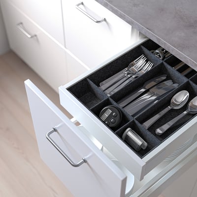 Kitchen drawer with cutlery organiser, featuring adjustable compartments for forks, knives, and spoons, with a digital timer and grater.