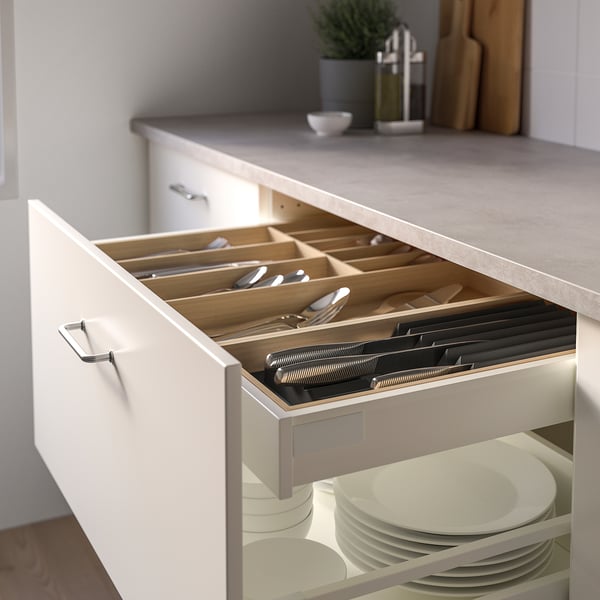 Open kitchen drawer with knife organiser, keeping knives sharp and easily accessible.