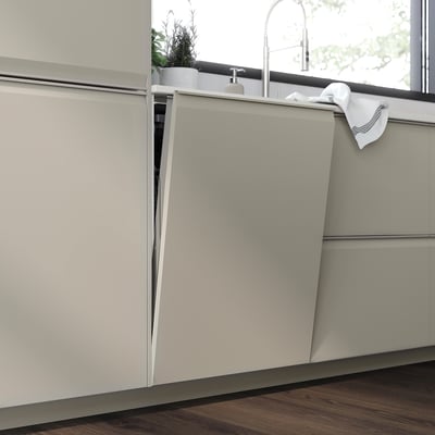 Modern kitchen with UPPLÖV beige cabinets, sleek handles, wood floor.