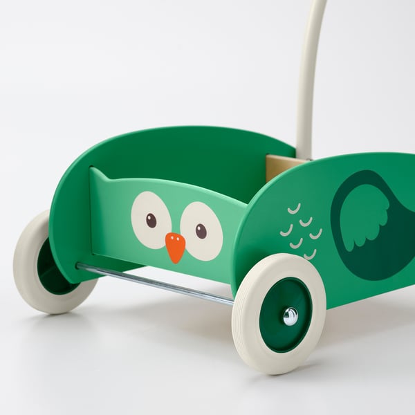 Infant walker shaped like green owl with large eyes, orange beak, and wings. Four white wheels and adjustable handle for stability and balance.