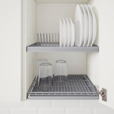 Metal dish drainer in cabinet with glasses, keeping countertops clear.
