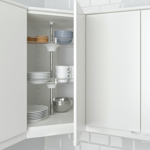Kitchen corner cabinet with revolving shelves for easy access to dishes.