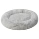 A round, soft grey UTSÅDD pet bed. Its designed for pets to curl up and relax, with a plush, calming high edge for comfort and support.
