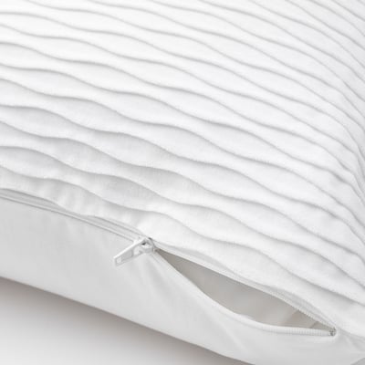 Close-up of a VÄNDEROT pillow with visible zip; dual-sided, quilted cover.