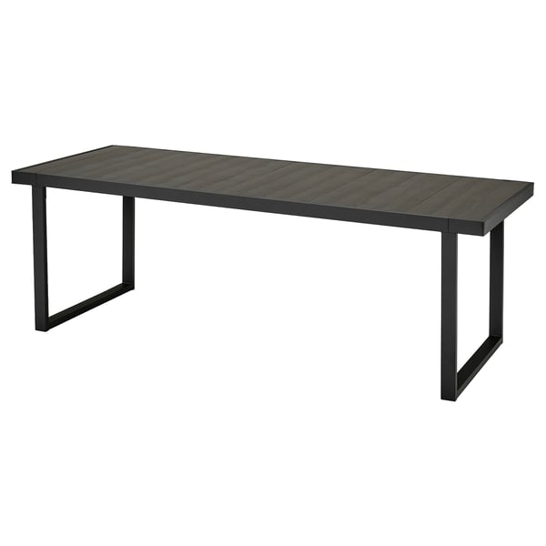 A VÄRMANSÖ black outdoor table with a wooden look, made of recycled aluminium and steel. Rectangular shape, modern design.