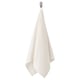 A VÅGSJÖN white hand towel hanging from a hook. Its rectangular, made of 100% cotton, with a textured surface.