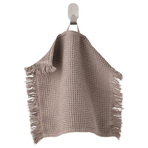 Scorerclip hanging beige waffle towel, fringed edges.