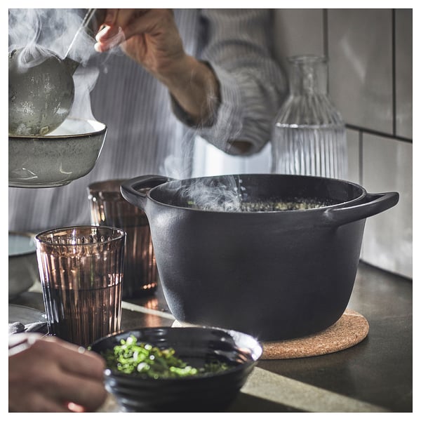 Steamer with veg and lid on trivet.