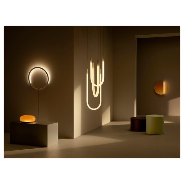 Modern lamp showcase: wall, pendant, & table lamps in dark room.