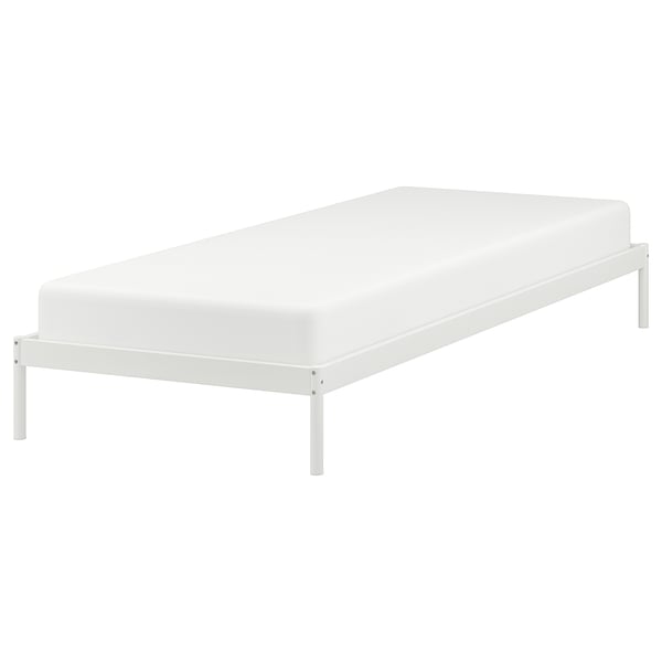 Minimalist VEVELSTAD bed, white metal frame, clean lines, easy storage.